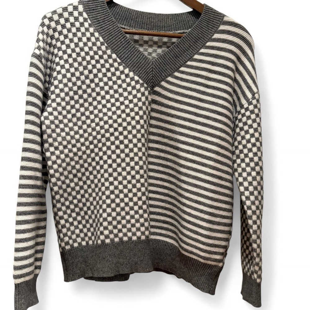 Gray and white checkered and striped sweater